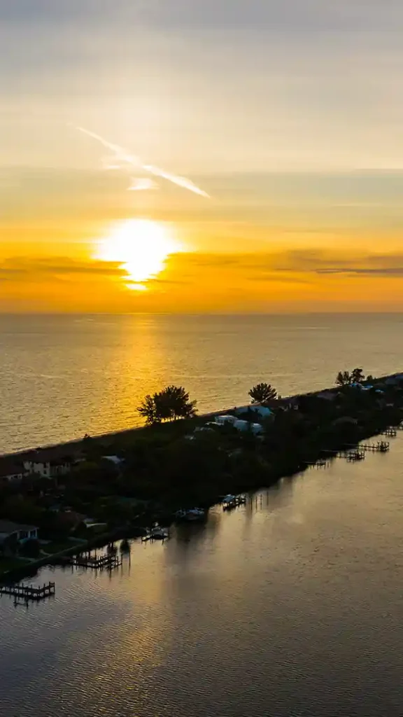 Sunset over Manasota Key, Florida with coastal haze